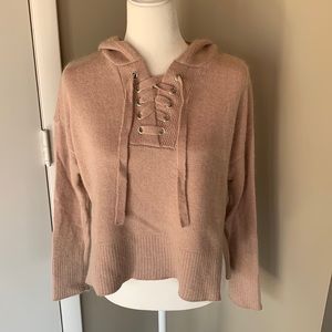 Pretty soft pink sweater with lace up detail and good